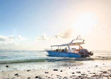 Pure Dive resort boat on beach